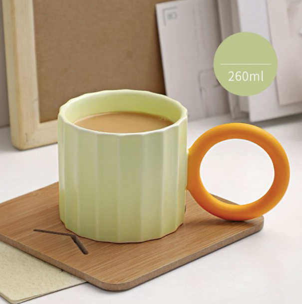 Handmade Ceramic Coffee Mug with Ornate Handle