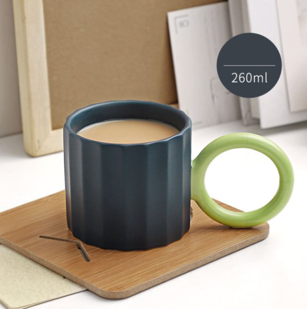 Handmade Ceramic Coffee Mug with Ornate Handle