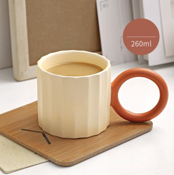 Handmade Ceramic Coffee Mug with Ornate Handle